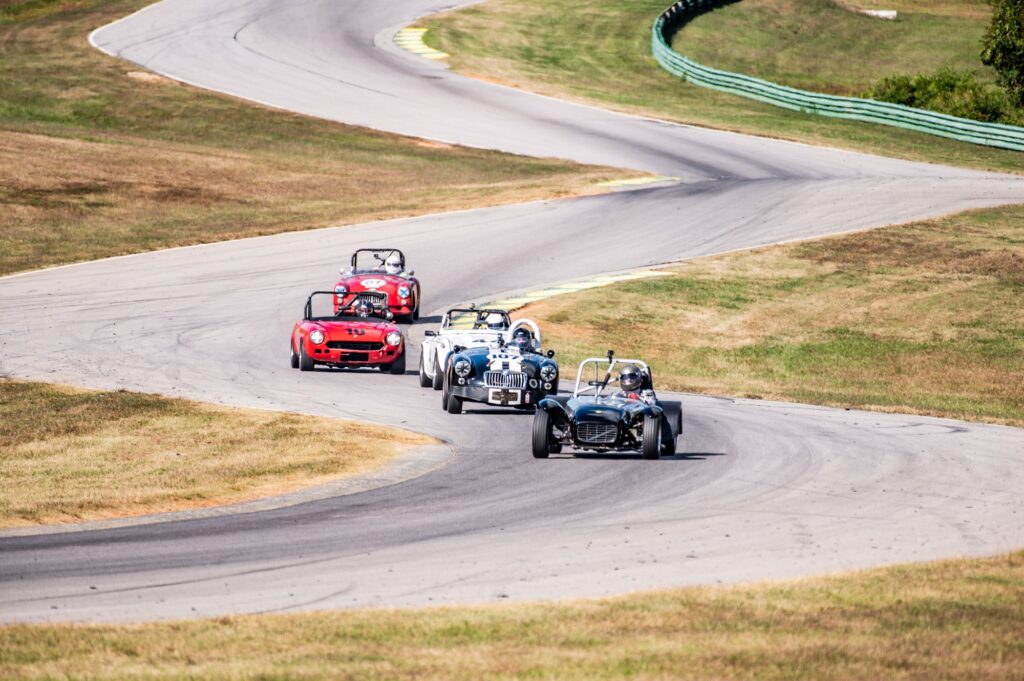 a group of cars on a road SVRA SpeedTour