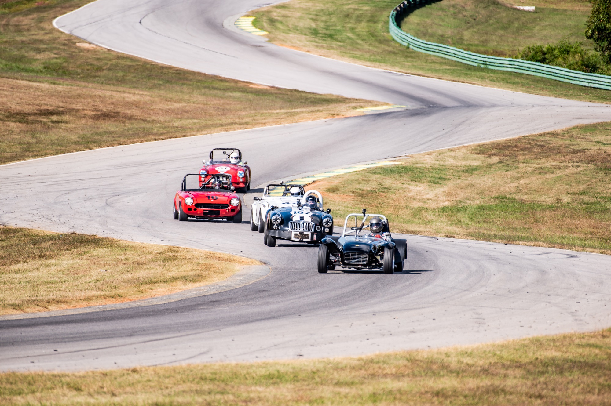 a group of cars on a road SVRA SpeedTour