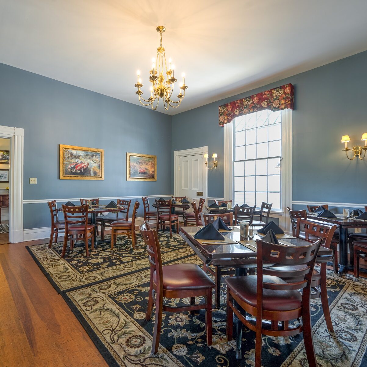 blue dining room at the oak tree tavern 1800s plantation house with wooden tables and chairs