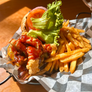 Hamburger and fries on a serving dish