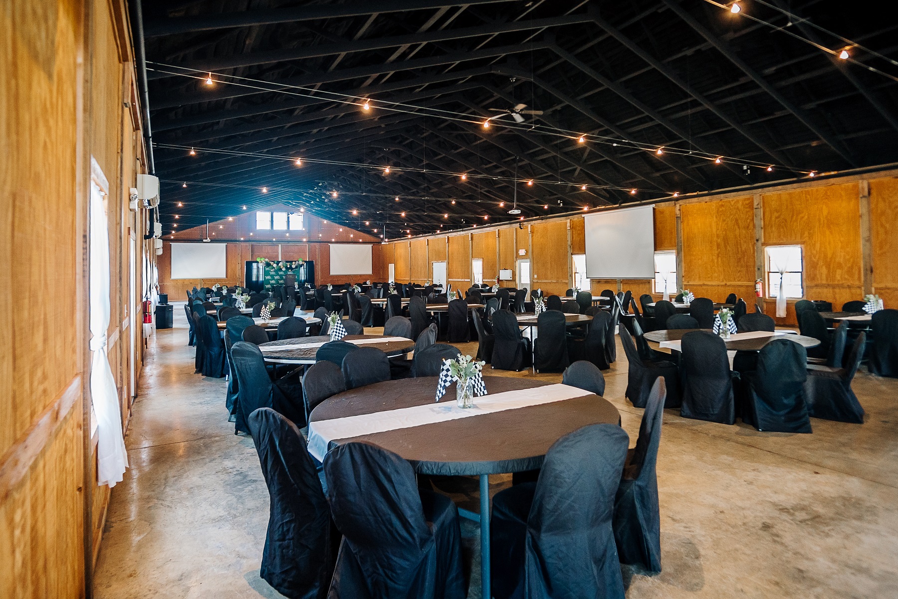 a room with tables and chairs prepared for an event