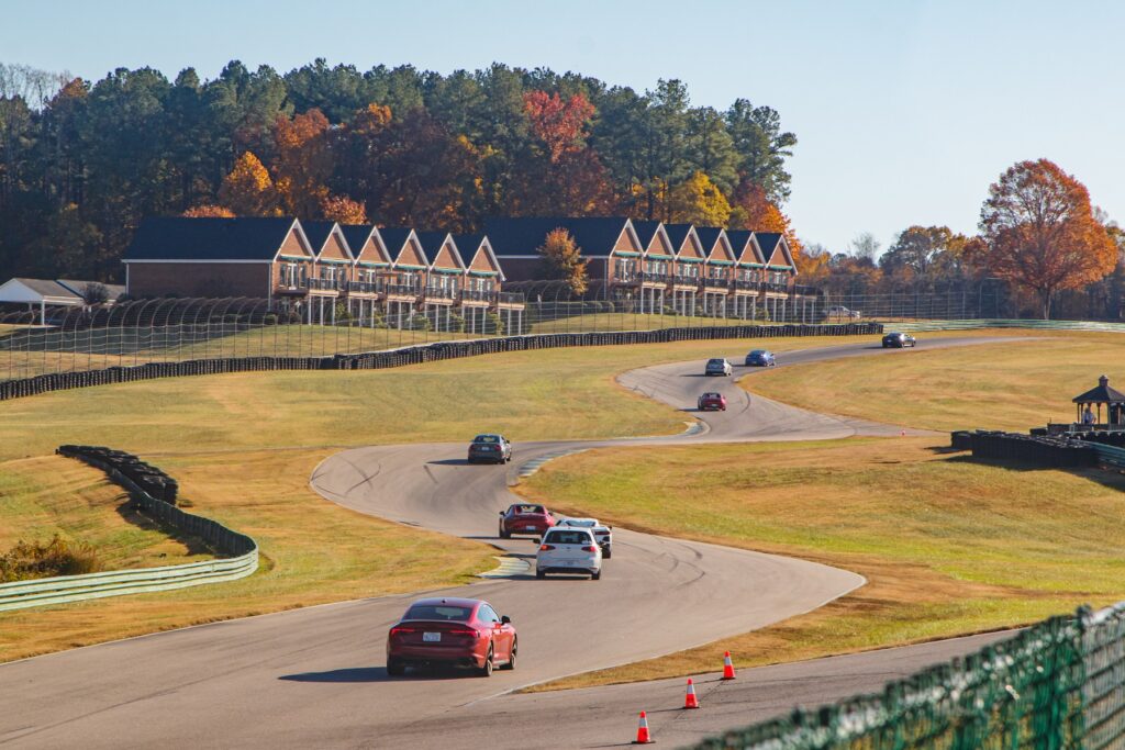 Victory Junction Charity laps cars on track with buildings in background